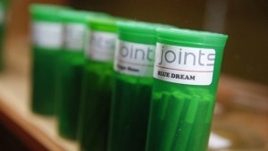 Green containers labeled "joints blue dreams"