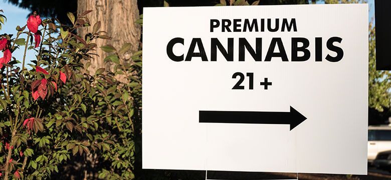 Premium cannabis 21+ sign with arrow