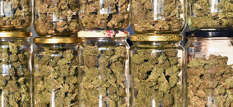 Homemade marijuana in mismatched jars