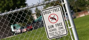 Drug Free zone sign on playground fence