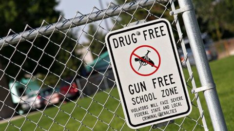 Drug Free zone sign on playground fence