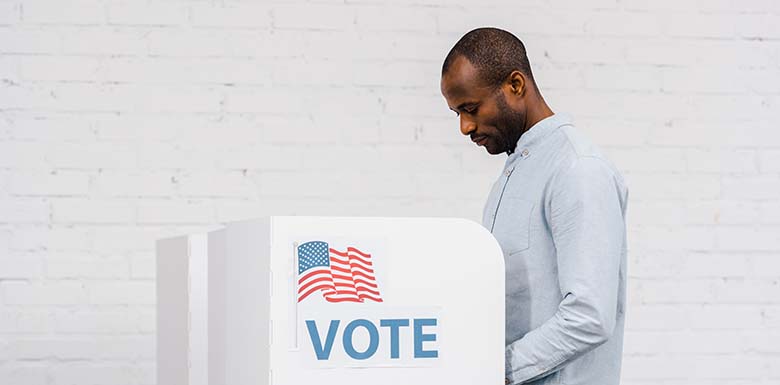 Man voting in light colored room